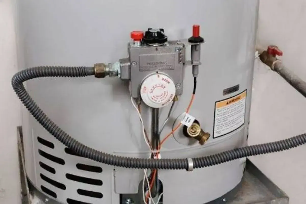 Gas control valve and pilot igniter on the side of a gray water heater